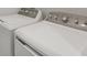 Modern laundry room with washer and dryer at 8746 Saint Kitts Cir, Englewood, FL 34224