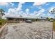 Aerial view of a house and parking lot at 9000 Griggs Rd # G, Englewood, FL 34224