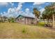 Ranch-style home with a spacious yard and palm trees at 9000 Griggs Rd # G, Englewood, FL 34224