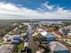 An aerial view showcasing a waterfront house's location in a residential area at 9240 Pine Cove Dr, Englewood, FL 34224