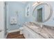 Elegant bathroom with granite countertops and a walk-in shower at 9240 Pine Cove Dr, Englewood, FL 34224