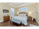 Bright bedroom featuring a king-size bed and ensuite bathroom access at 9240 Pine Cove Dr, Englewood, FL 34224