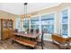 Dining area with a live-edge wood table and built in cabinetry at 9240 Pine Cove Dr, Englewood, FL 34224