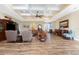 Comfortable living room featuring hardwood floors and a coffered ceiling at 9240 Pine Cove Dr, Englewood, FL 34224