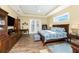 Spacious main bedroom with hardwood floors and a walk-in closet at 9240 Pine Cove Dr, Englewood, FL 34224