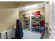 Organized storage room with shelving for luggage and seasonal items at 9240 Pine Cove Dr, Englewood, FL 34224