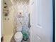 Small bathroom with toilet and shower at 93 Boundary Blvd # 301, Rotonda West, FL 33947