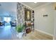 Entryway with a console table, stylish wall art, and a view into the living area at 93 Boundary Blvd # 301, Rotonda West, FL 33947