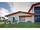 Back exterior view showing patio and AC unit at 93 Boundary Blvd # 301, Rotonda West, FL 33947