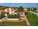 Attractive exterior of a two-story home with a red tile roof and landscaping at 93 Boundary Blvd # 301, Rotonda West, FL 33947