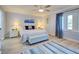 Spacious main bedroom with a king-size bed and plenty of natural light at 93 Boundary Blvd # 301, Rotonda West, FL 33947