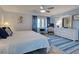 Main bedroom with king-size bed, workspace, and ample closet space at 93 Boundary Blvd # 301, Rotonda West, FL 33947