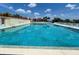 Inviting community pool with lounge chairs at 93 Boundary Blvd # 301, Rotonda West, FL 33947