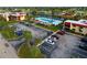 Community pool and parking area viewed from above at 93 Boundary Blvd # 301, Rotonda West, FL 33947