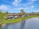 Aerial view of condo community situated along a canal at 1 Quails Run Blvd # 5, Englewood, FL 34223