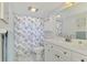 Clean bathroom with updated white vanity at 1 Quails Run Blvd # 5, Englewood, FL 34223