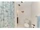 Clean bathroom with shower and coastal decor at 1 Quails Run Blvd # 5, Englewood, FL 34223