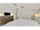 Bright bedroom with a comfortable bed and water view at 1 Quails Run Blvd # 5, Englewood, FL 34223
