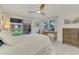 Bedroom with water views and built-in workspace at 1 Quails Run Blvd # 5, Englewood, FL 34223