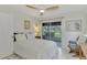 Bedroom with canal view and ceiling fan at 1 Quails Run Blvd # 5, Englewood, FL 34223