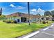 Community center with mailbox and landscaping at 1 Quails Run Blvd # 5, Englewood, FL 34223