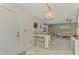 Condo dining area with view into the living room and kitchen at 1 Quails Run Blvd # 5, Englewood, FL 34223