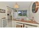 Condo dining area with view into the living room and kitchen at 1 Quails Run Blvd # 5, Englewood, FL 34223