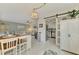 Condo dining area with view into the living room and kitchen at 1 Quails Run Blvd # 5, Englewood, FL 34223