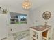 Bright dining area with a small table and chairs, near the kitchen at 1 Quails Run Blvd # 5, Englewood, FL 34223