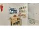 Well-equipped kitchen with a pantry and wooden kitchen island at 1 Quails Run Blvd # 5, Englewood, FL 34223