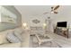 Spacious living room featuring a neutral color palette and tiled floors at 1 Quails Run Blvd # 5, Englewood, FL 34223
