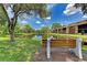 Serene pond with fountain and bench at 1 Quails Run Blvd # 5, Englewood, FL 34223