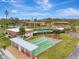 Community shuffleboard courts with covered seating at 1 Quails Run Blvd # 5, Englewood, FL 34223