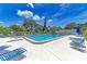 Refreshing community swimming pool with lounge chairs at 1 Quails Run Blvd # 5, Englewood, FL 34223