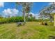 Spacious backyard with grassy area and patio furniture at 11247 Euler Ave, Englewood, FL 34224