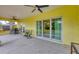 Covered patio with seating area and sliding glass doors at 11247 Euler Ave, Englewood, FL 34224