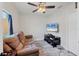 Cozy Gathering room featuring a brown couch and large TV at 11247 Euler Ave, Englewood, FL 34224