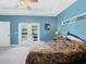 Main bedroom with sliding doors leading to the backyard at 11247 Euler Ave, Englewood, FL 34224