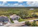 Aerial view showcasing the home's setting at 1169 Boundary Blvd, Rotonda West, FL 33947