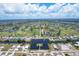 Aerial view of a waterfront community with golf course and marina at 1169 Boundary Blvd, Rotonda West, FL 33947