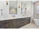 Modern bathroom with double vanity, quartz countertop, and a soaking tub at 1169 Boundary Blvd, Rotonda West, FL 33947