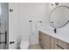 Modern bathroom with a single vanity, a toilet, and a walk-in shower at 1169 Boundary Blvd, Rotonda West, FL 33947