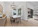 Bright dining room with a large table and chandelier at 1169 Boundary Blvd, Rotonda West, FL 33947