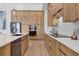 Modern kitchen with stainless steel appliances and wood cabinets at 1169 Boundary Blvd, Rotonda West, FL 33947