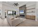 Open concept living area with sectional and fireplace at 1169 Boundary Blvd, Rotonda West, FL 33947