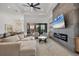 Open living area with sectional sofa and fireplace at 1169 Boundary Blvd, Rotonda West, FL 33947