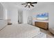 Bright bedroom with king bed, dresser, and large TV at 1169 Boundary Blvd, Rotonda West, FL 33947