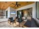 Outdoor patio with seating area, wood ceiling, and a view of the living room at 1169 Boundary Blvd, Rotonda West, FL 33947