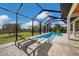 Enjoy this refreshing pool area, complete with lounge chairs at 1169 Boundary Blvd, Rotonda West, FL 33947