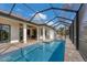 Private pool and patio with screened enclosure at 1169 Boundary Blvd, Rotonda West, FL 33947